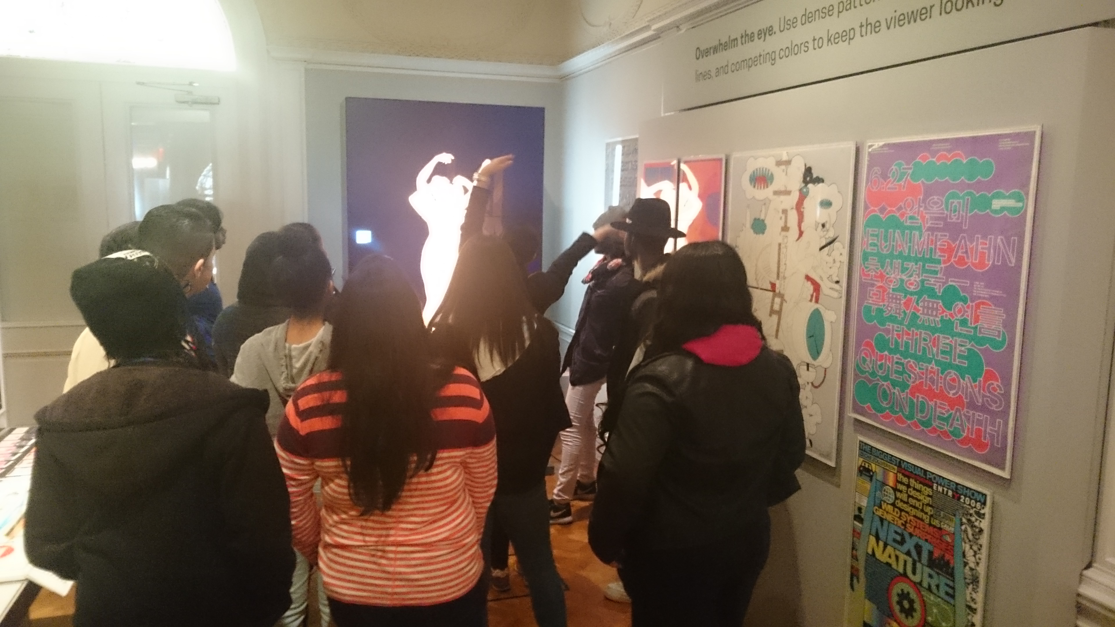 picture of group using full body gestures to browse the collection